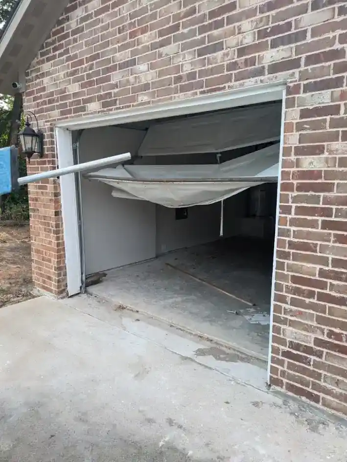 Damaged garage door panels before replacement
