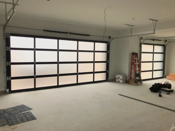 Interior view of frosted full view glass garage doors with track system