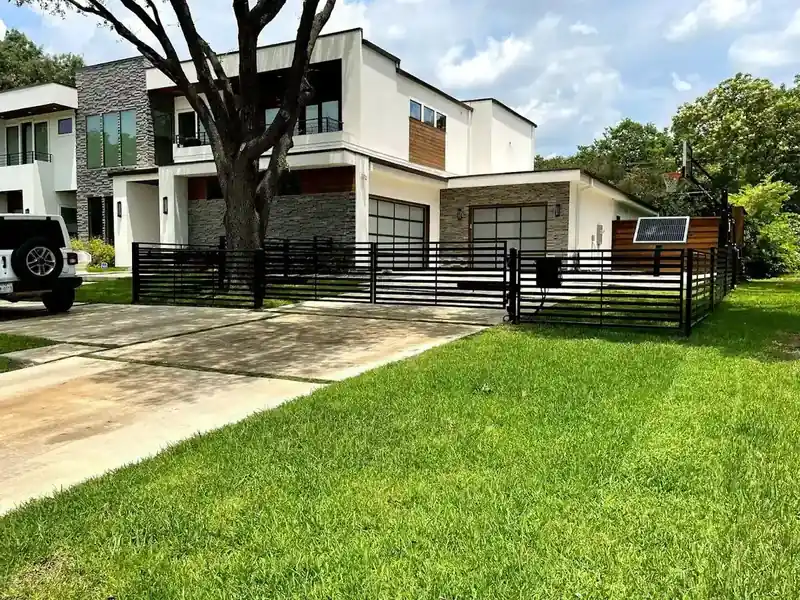 Modern full view glass garage door installation in North Dallas