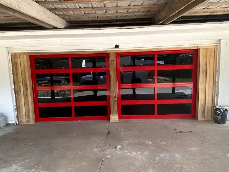 Red full view glass garage doors exterior installation
