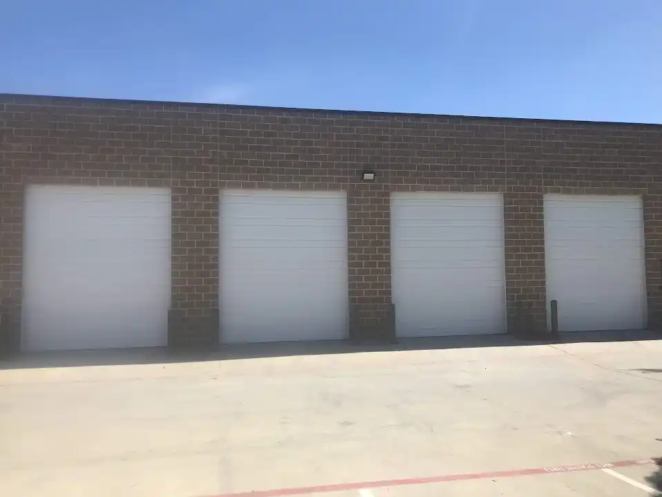 Multi-bay commercial overhead door installation at Dallas service facility