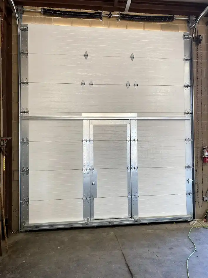 Commercial pass-through door installation at industrial facility in Dallas, TX