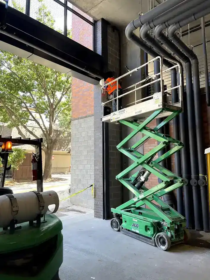 Commercial rolling steel door installation on urban Dallas storefront