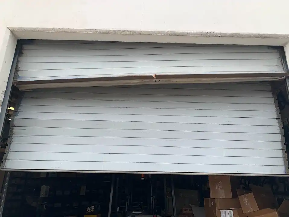 Rolling steel door curtain and guide repair at Dallas industrial facility