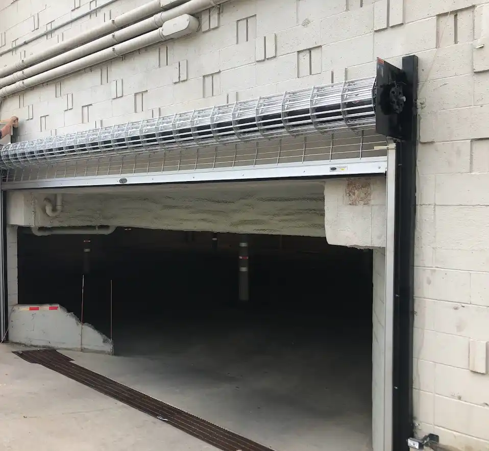 Rolling steel grill door installation on commercial property in Dallas, TX