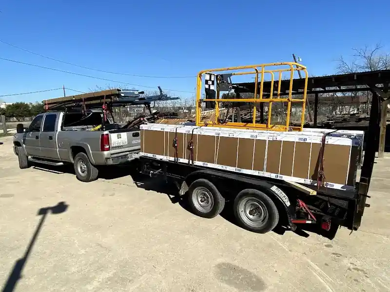 Sectional overhead door panels on delivery truck for Dallas installation