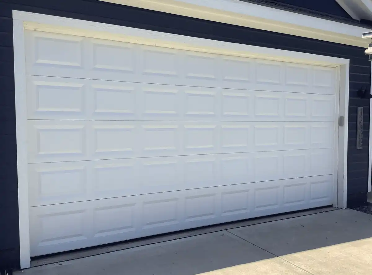 Lift cable and roller replacement on insulated steel double garage door in Carrollton TX